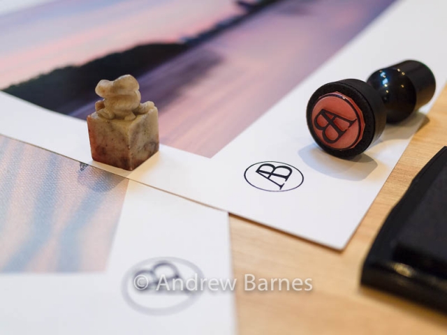 A Chinese soapstone seal alongside a rubber stamp showing the photographer Andrew Barnes